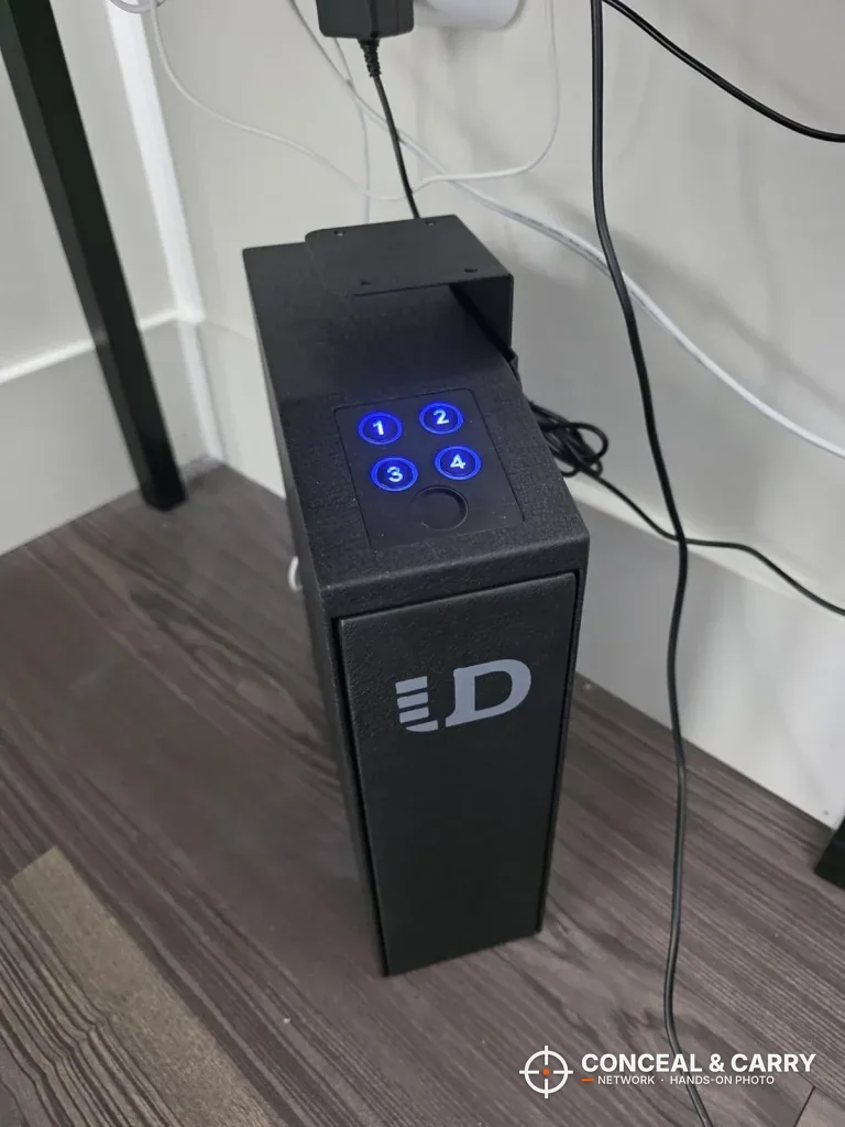 Urban Deco biometric safe standing upright with the keypad lit blue