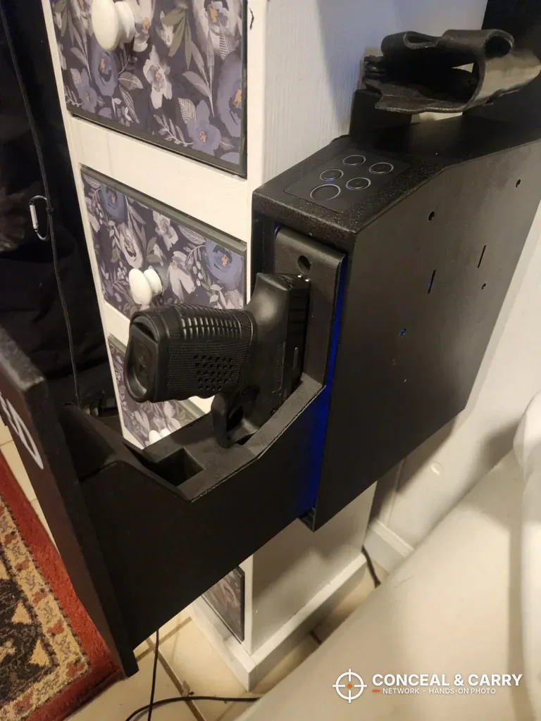 Pistol grip-out in the open door of the wall-mounted Urban Deco safe