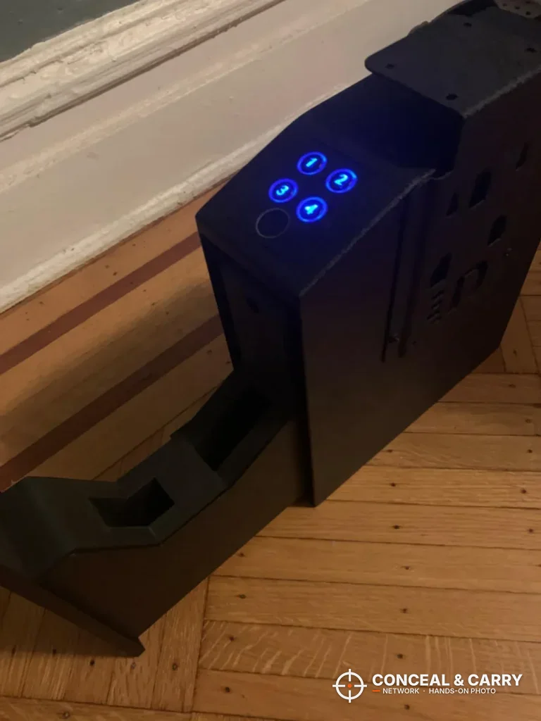 Urban Deco biometric safe with the sliding door open below the lit keypad