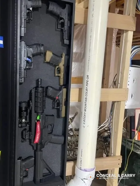 V-Line long gun safe open upright with foam holding a rifle and handguns