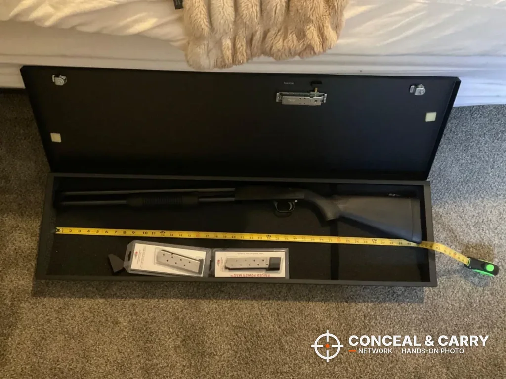 Tape measure along the inside length of the V-Line long gun safe with a shotgun inside