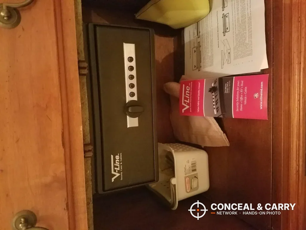 V-Line Slide-Away closed inside a cabinet with the push-button lock on the drawer front