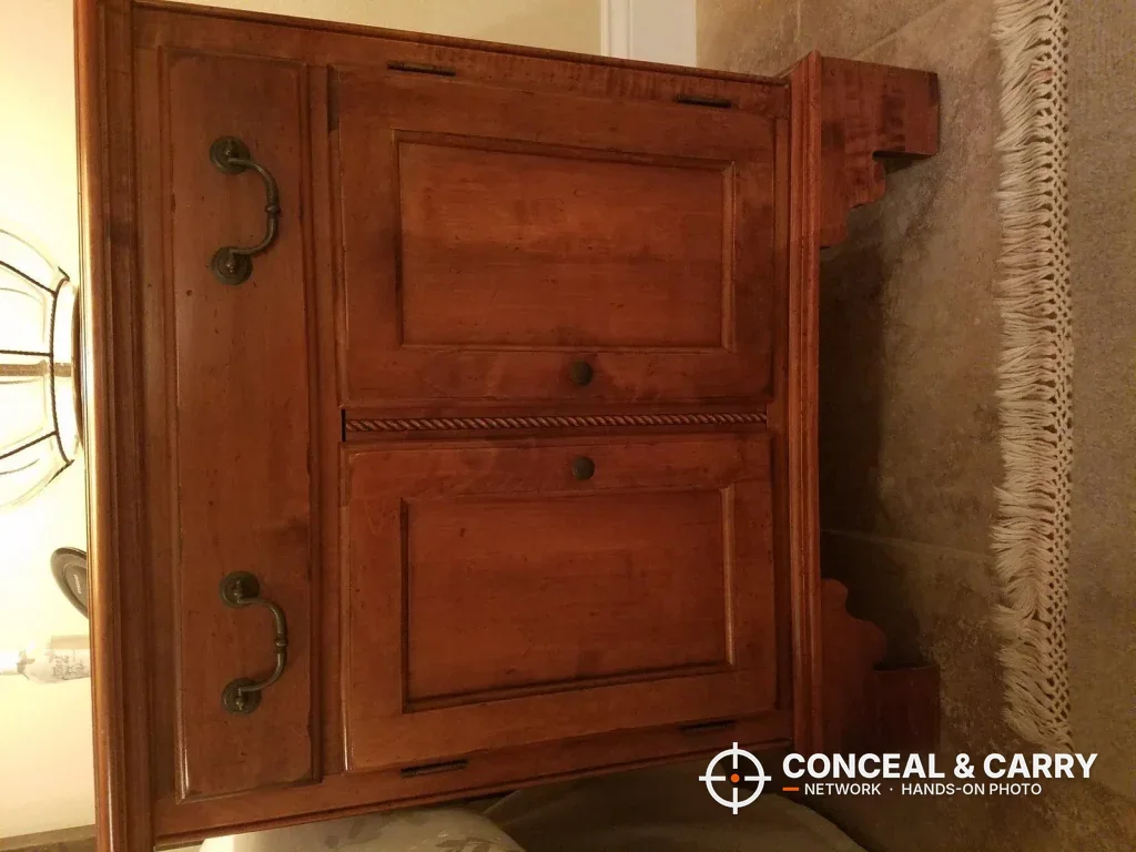 Closed wooden nightstand cabinet of the kind the V-Line Slide-Away can hide inside