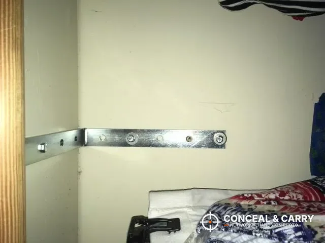 Steel mounting bracket for the V-Line Slide-Away screwed to a closet wall
