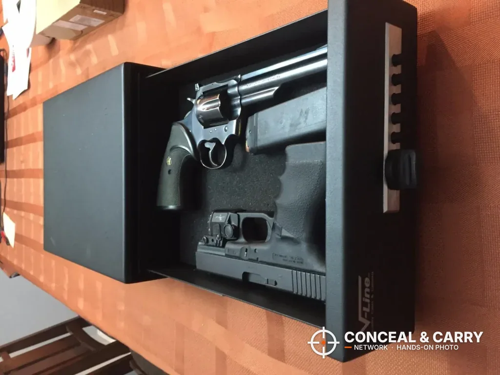 V-Line Slide-Away drawer pulled out with a revolver and a pistol in the foam