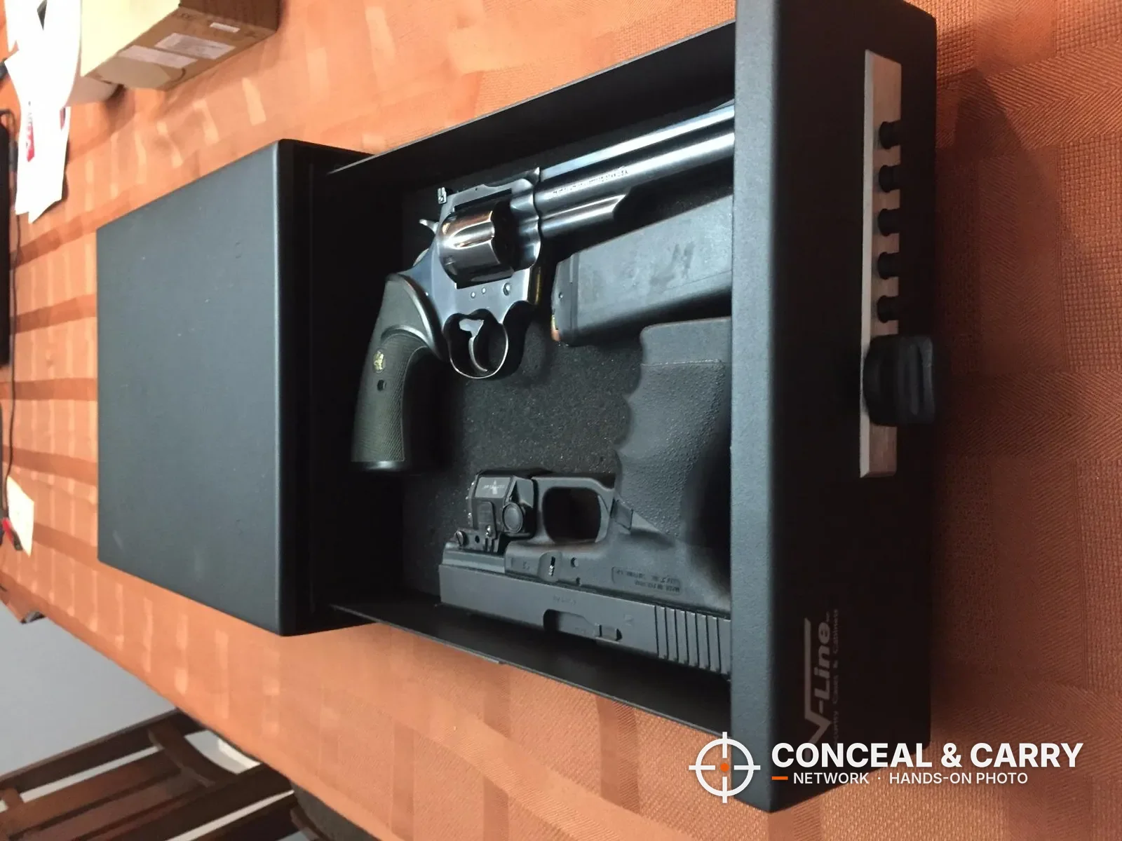 V-Line Slide-Away drawer pulled out with a revolver and a pistol in the foam