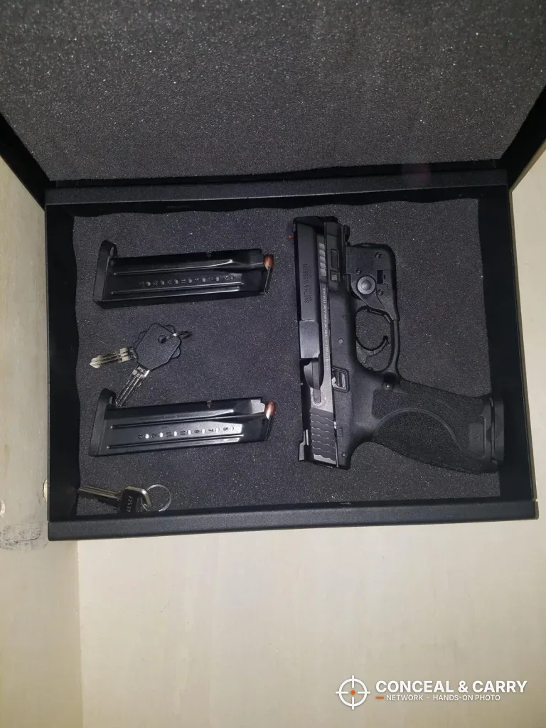 Pistol and two magazines set into foam inside the V-Line Top Draw