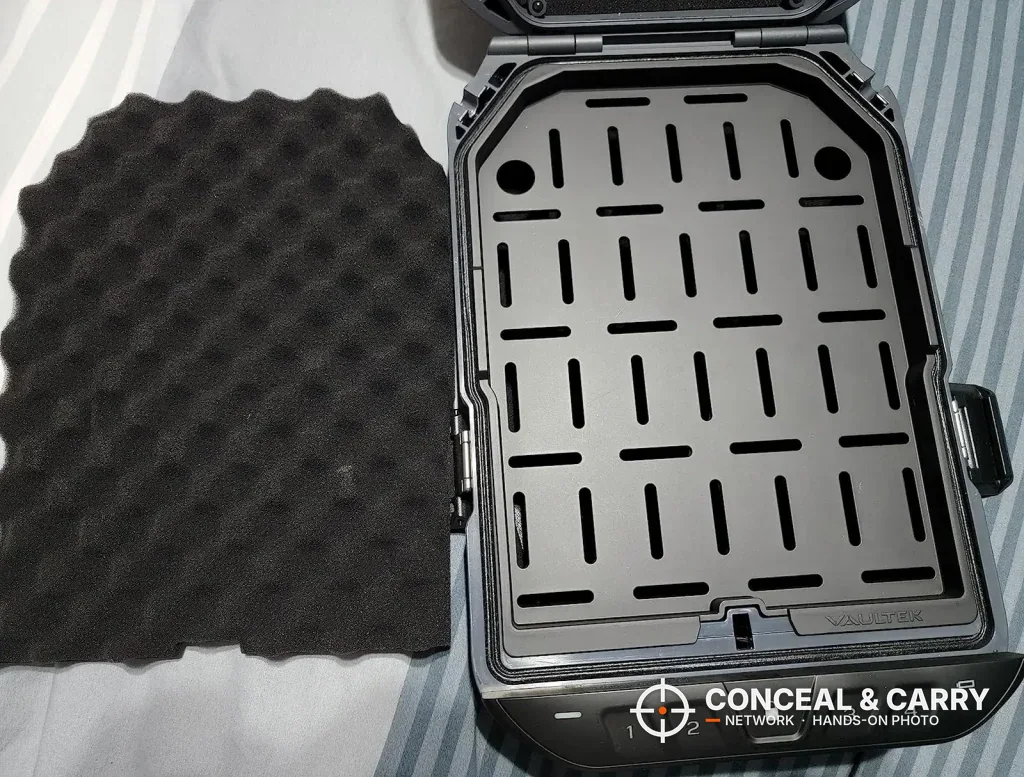 Vaultek LifePod 20 open with the slotted tray in the base and the foam pad set aside