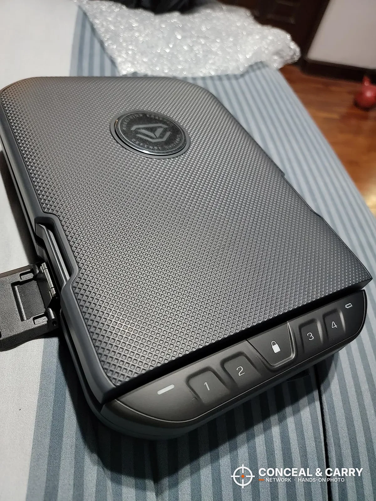 Vaultek LifePod 20 closed, showing the textured lid, front keypad and a side latch