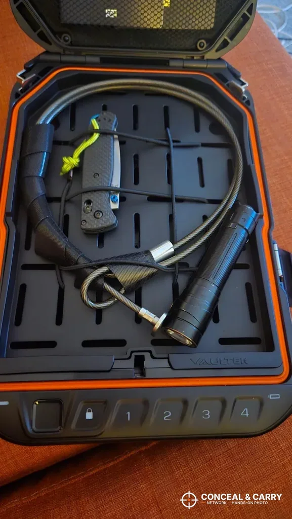 Steel security cable coiled on the tray inside the Vaultek LifePod 20 Biometric
