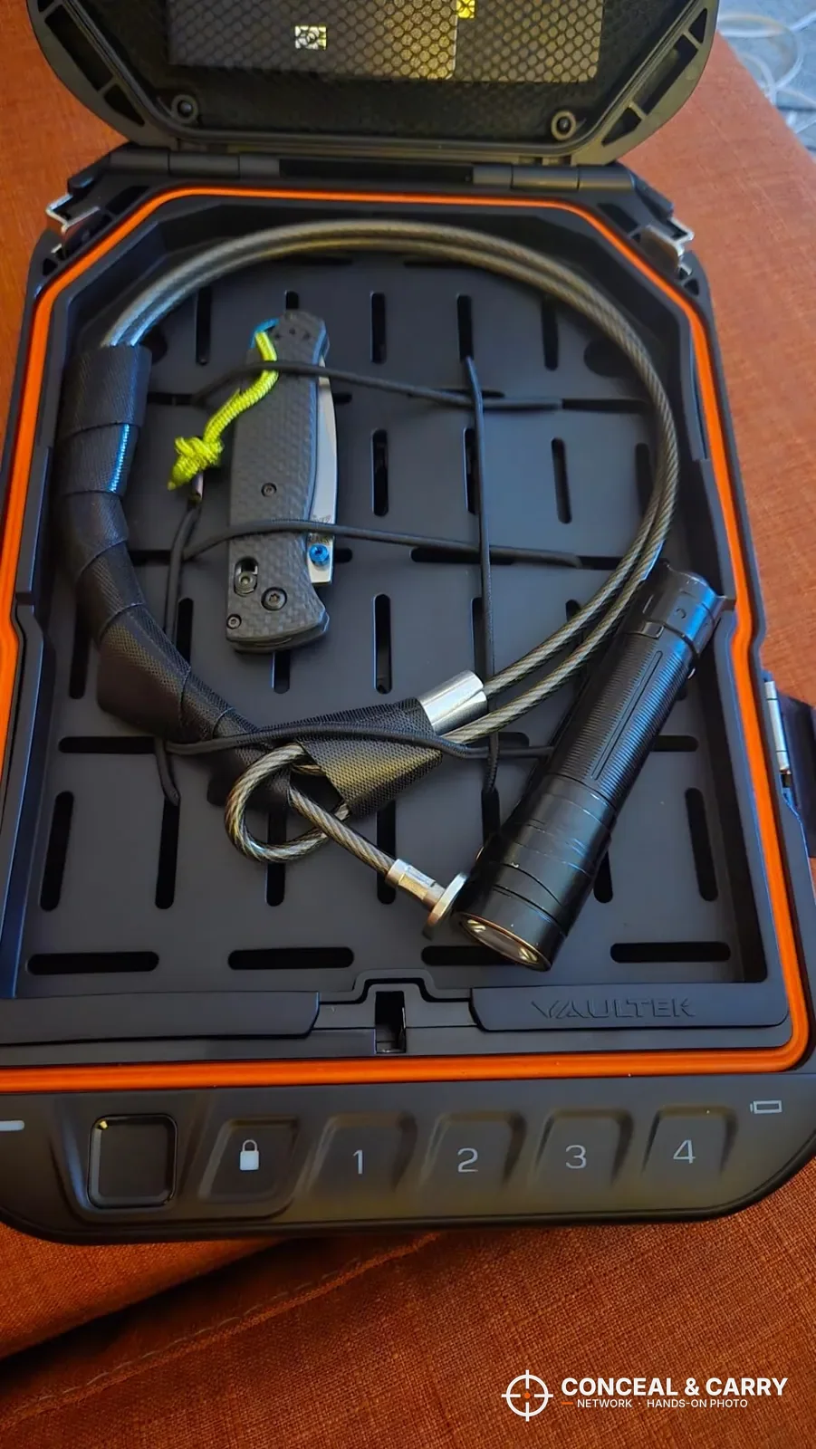 Security cable coiled inside the Vaultek LifePod 20 Biometric