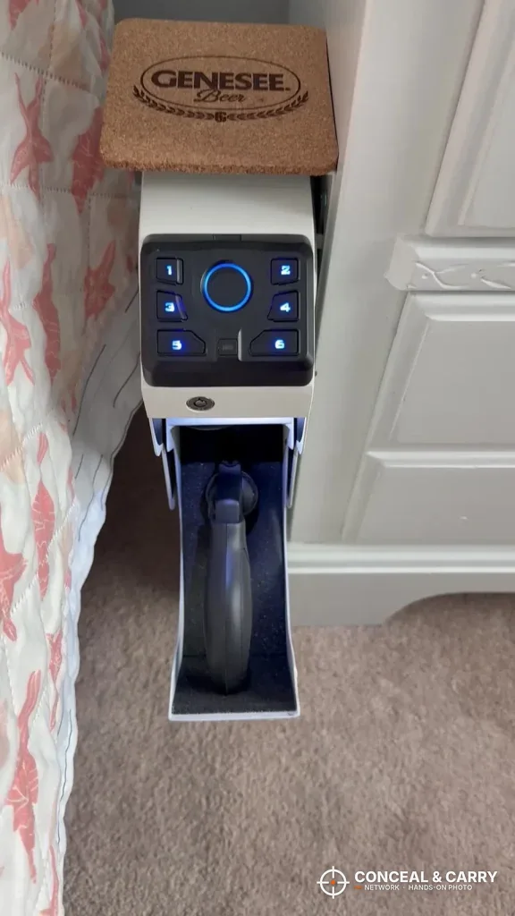 White VERPROOF gun safe with a lit keypad and the drawer open on a pistol grip