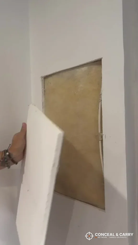 Opening cut in the drywall to fit the VEVOR hidden wall gun safe