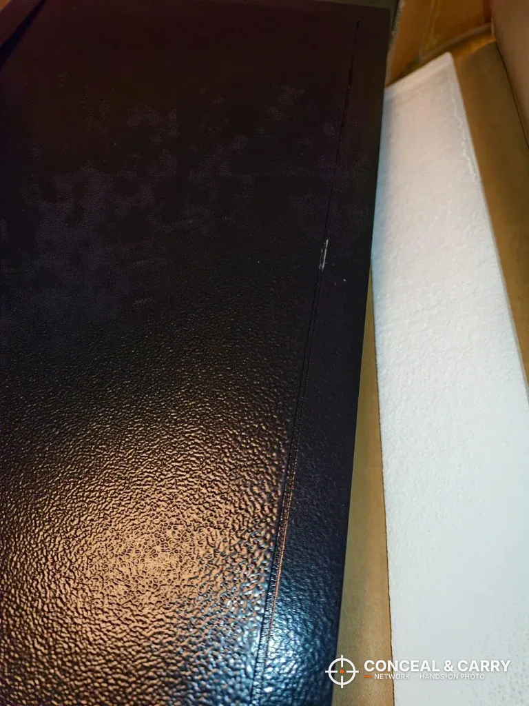 Textured black powder-coat finish on the VEVOR hidden wall gun safe