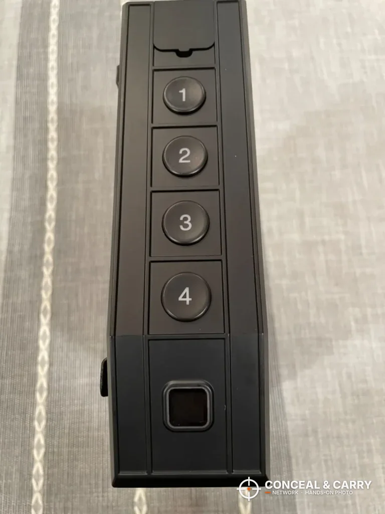 Close-up of the VoleStay top edge with four buttons and the fingerprint reader