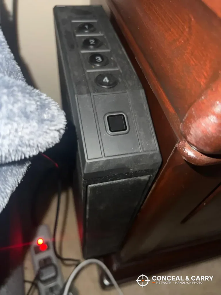 Front of the VoleStay keypad and fingerprint reader beside wooden furniture