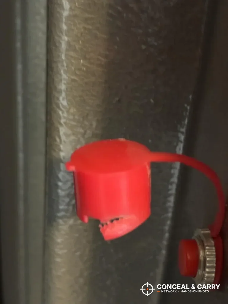 Red tethered plastic cap on the Wasatch 18EGW gray steel