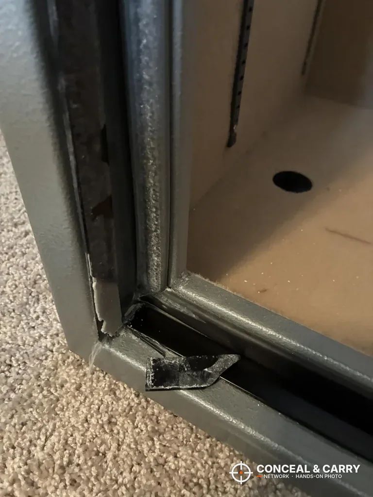 Wasatch 18EGW door open at the bottom corner with a round hole in the safe floor