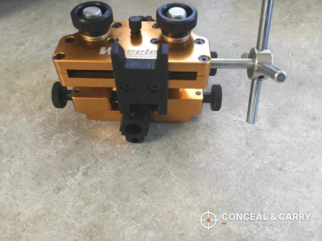 Wheeler Armorer's Handgun Sight Tool on a concrete floor with its side handle attached