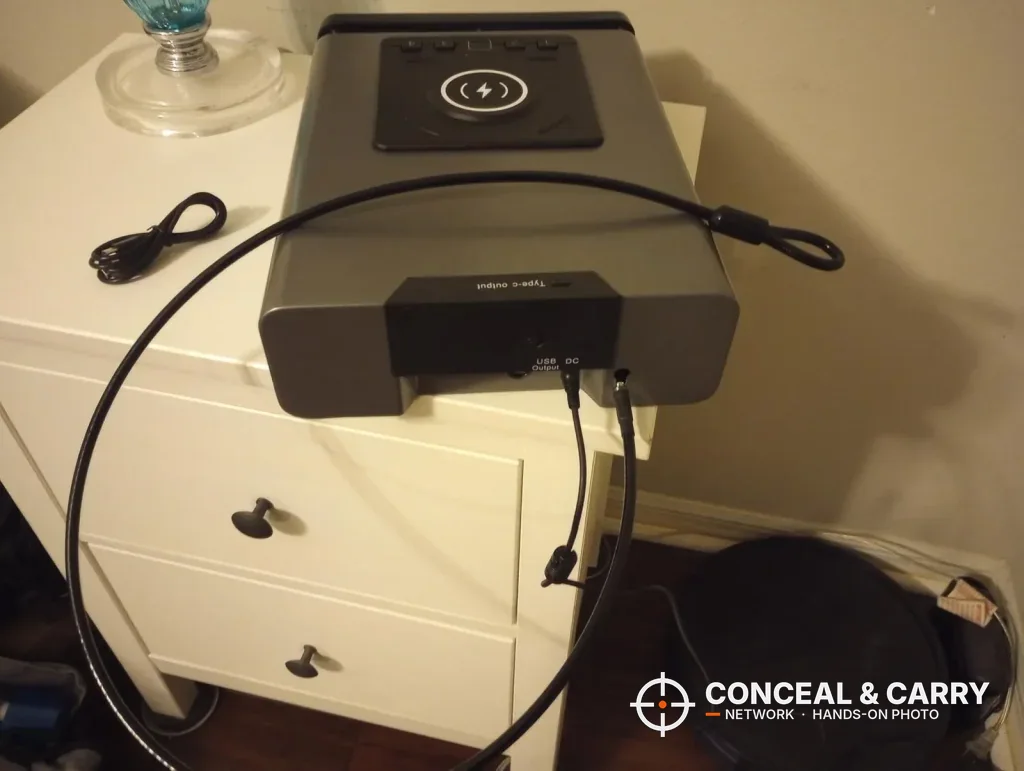 XDeer safe on a nightstand with the steel security cable looped behind it