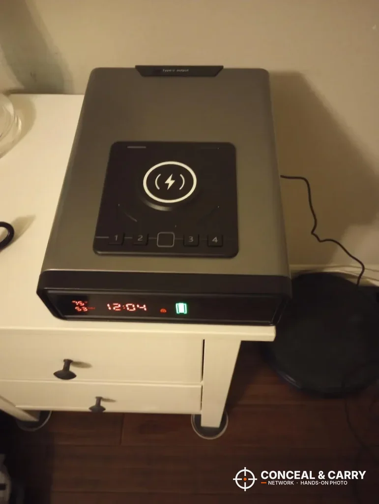 XDeer biometric safe sitting on a white nightstand
