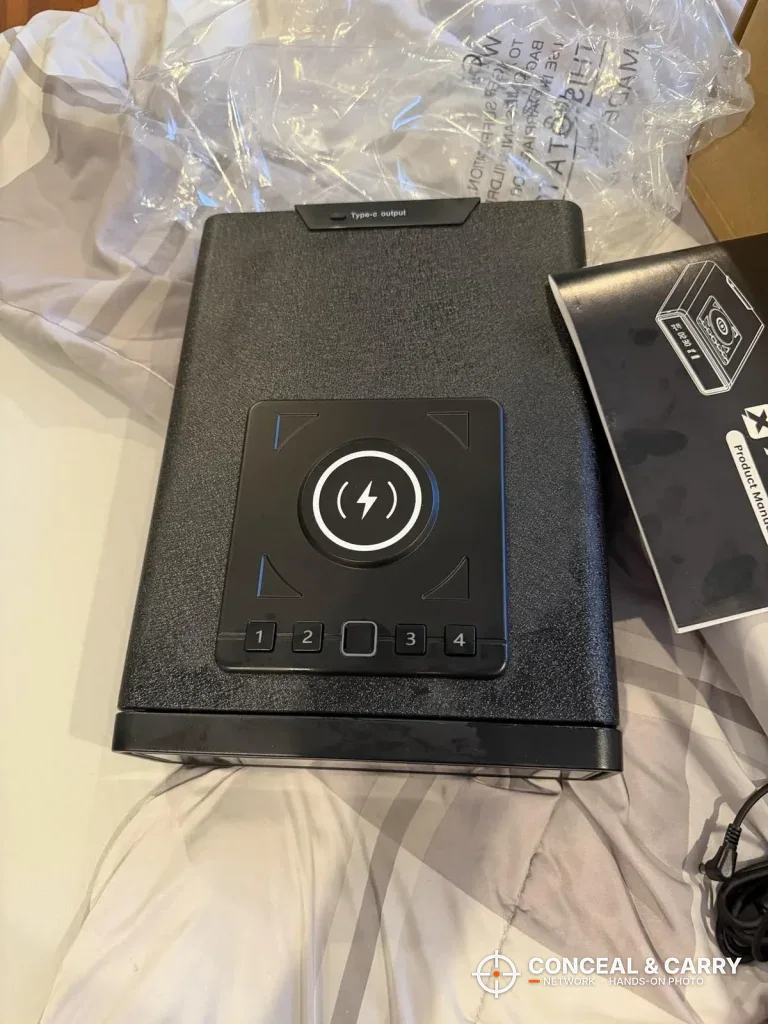 XDeer biometric safe in its packing with the user manual beside it