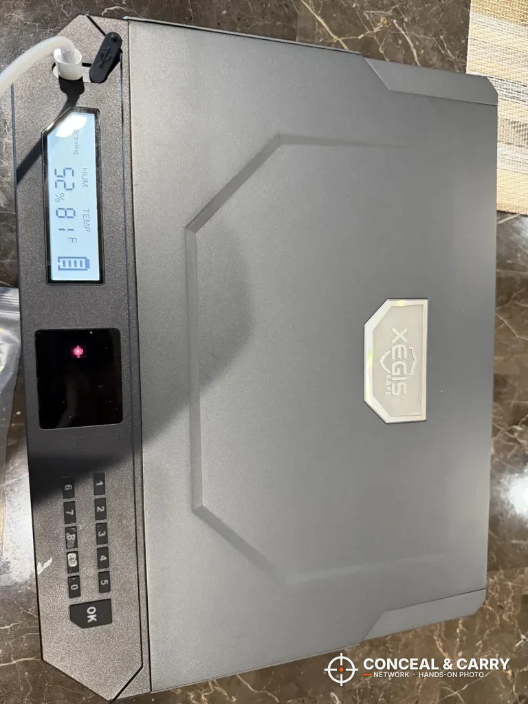 XEGIS palm vein gun safe lid from above with the front panel along one edge