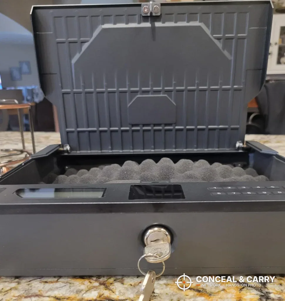 XEGIS gun safe lid raised showing the underside of the lid and the foam floor