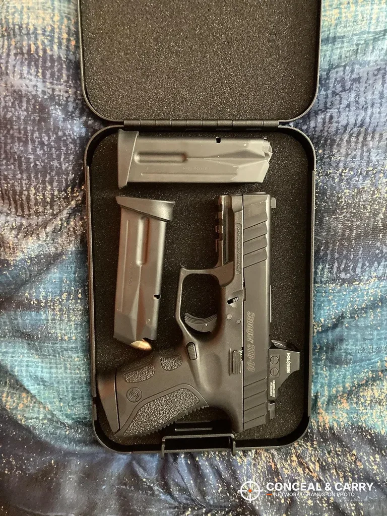 Compact pistol and magazine inside the Younion portable pistol safe