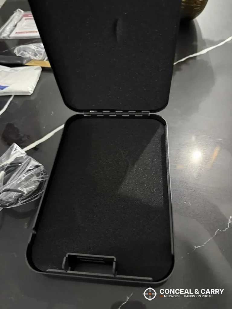 Empty Younion pistol safe open with foam in the lid and base