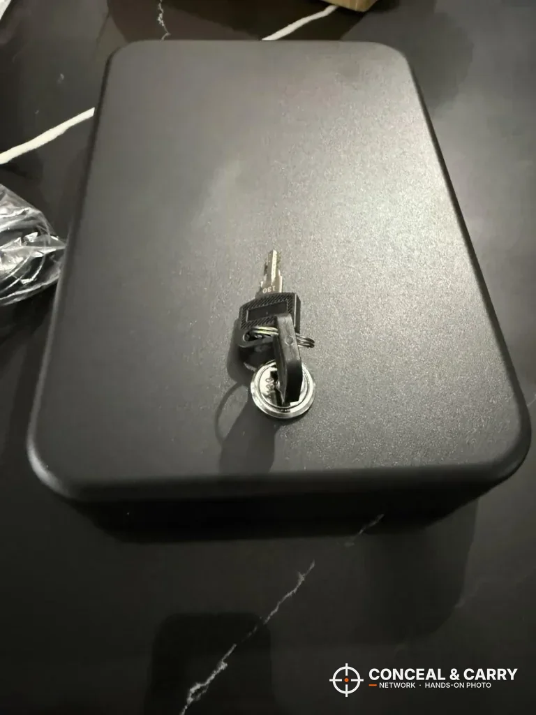Younion pistol safe closed with the key in the lock