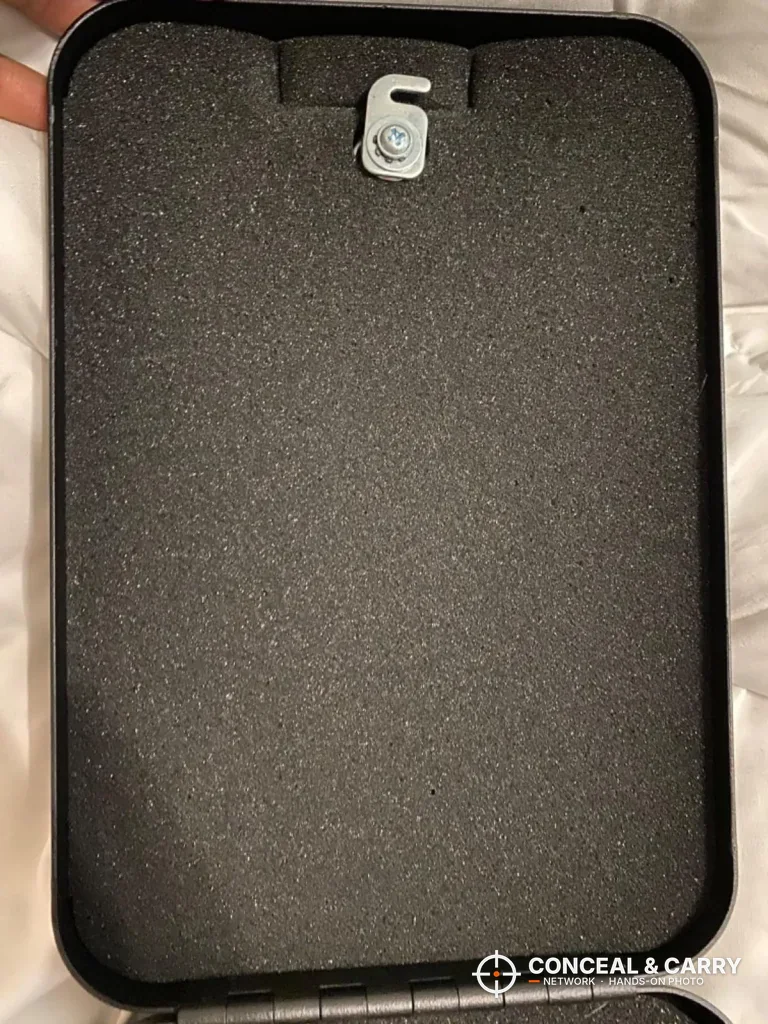 Foam-lined Younion pistol safe with the latch hook at the edge